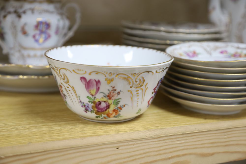 A 19th century Continental twenty nine piece gilt and floral coffee set, monogrammed, coffee pot 26cm